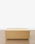 Table basse en bois moderne avec tiroirs de rangement coulissants et lignes épurées pour salon