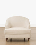 Fauteuil de salon classique capitonné avec accoudoirs roulés et pieds à roulettes pour salon
