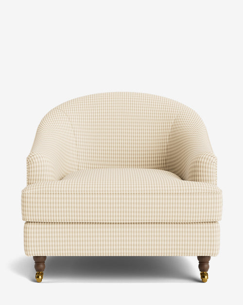 Fauteuil club classique rembourré avec accoudoirs roulés, passepoil décoratif et roulettes, pour le salon